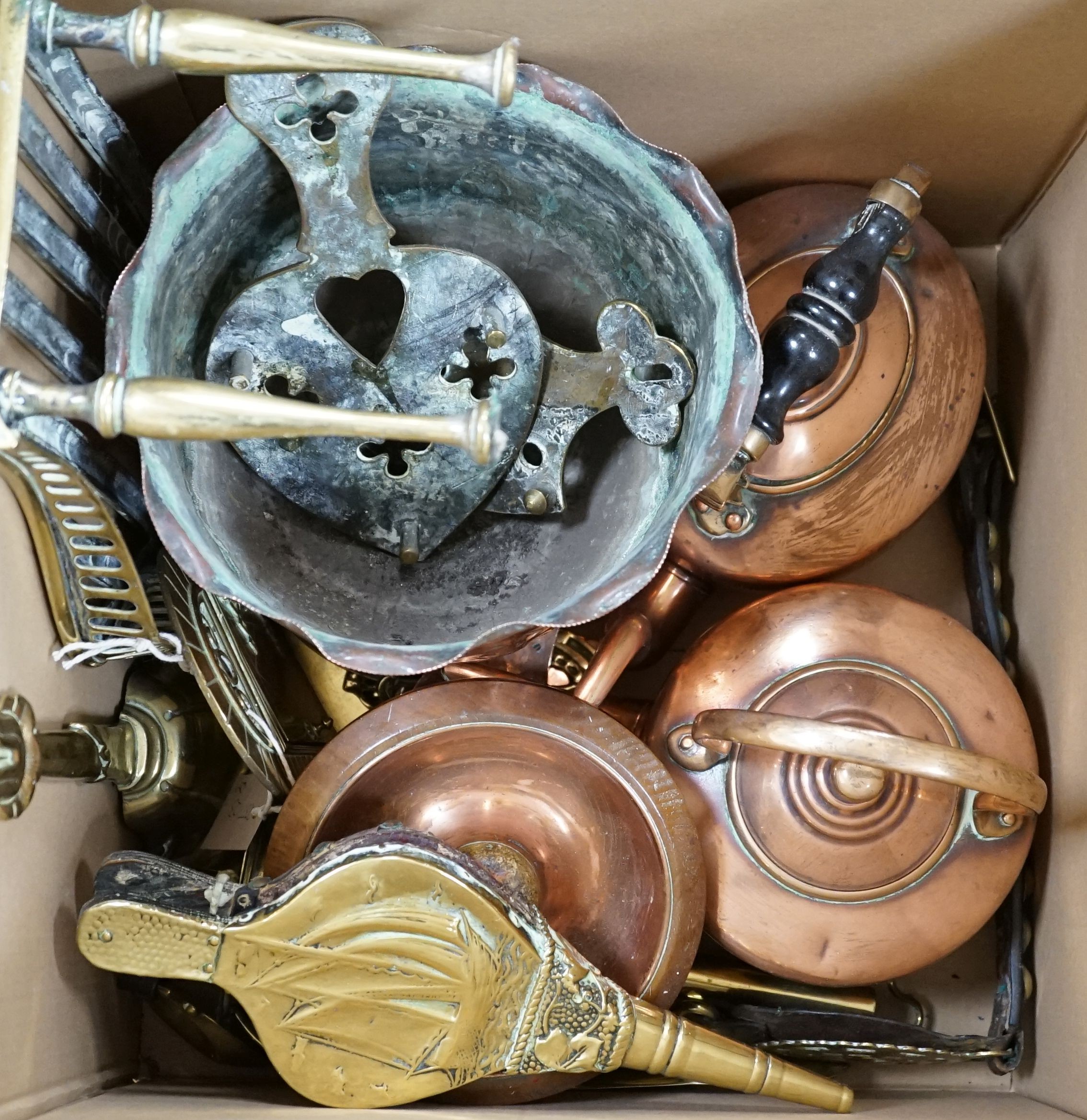 A collection of antique brass and copper items to include kettle, horse brasses, miniature door way, bottle-jack etc